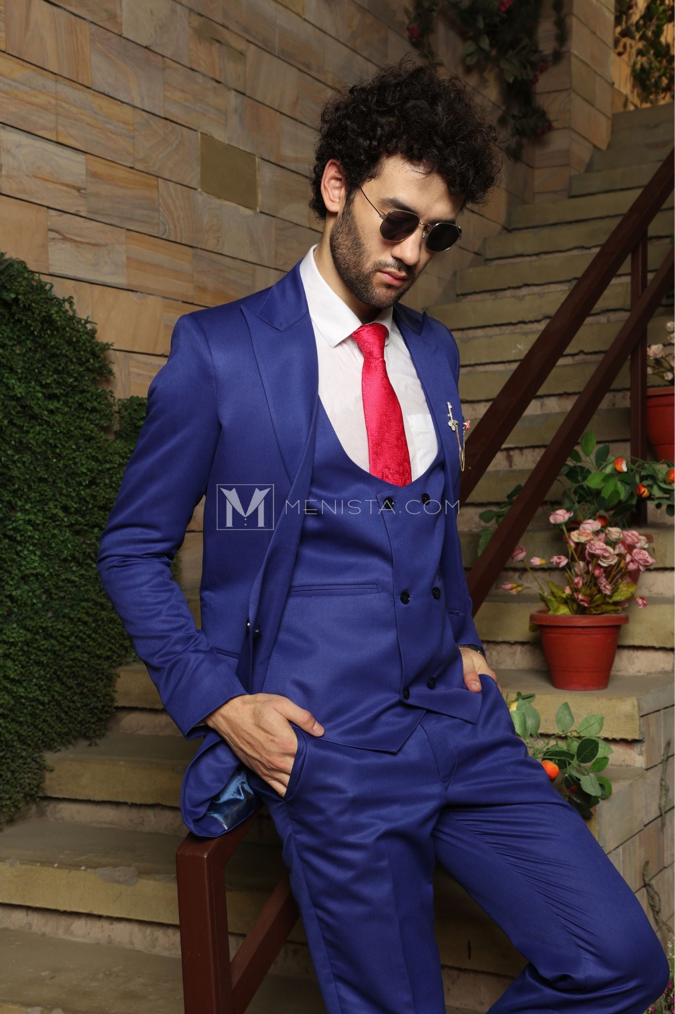 royal blue suit with a red shirt
