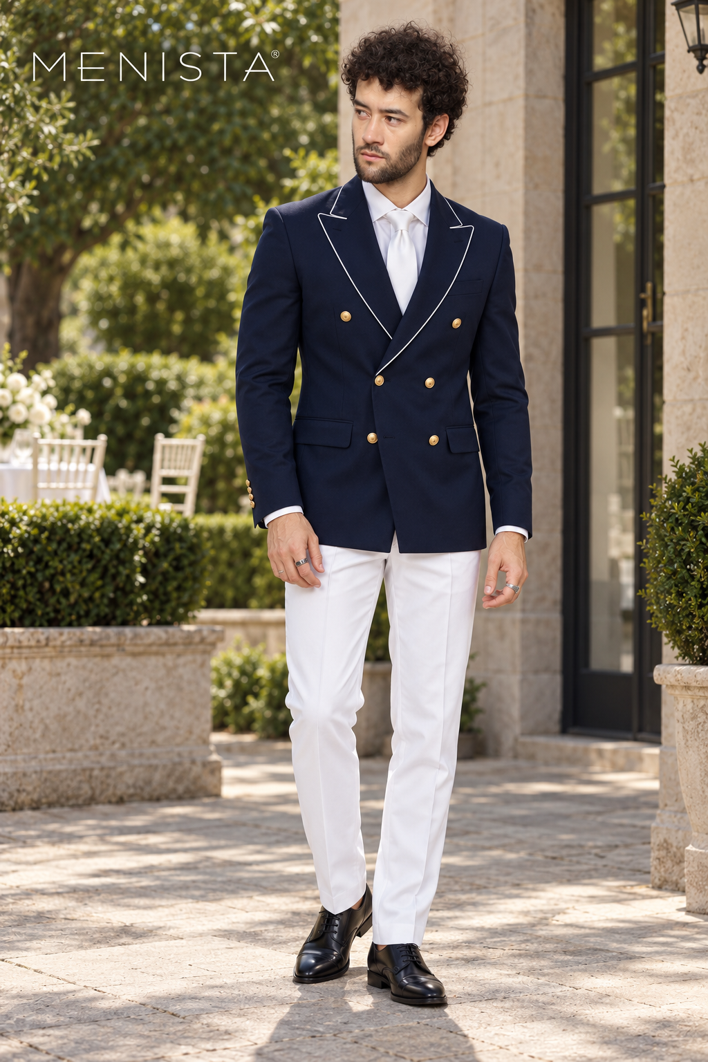 Full front view of Menista navy double-breasted suit with white lapel piping, six gold metal buttons and white trousers.