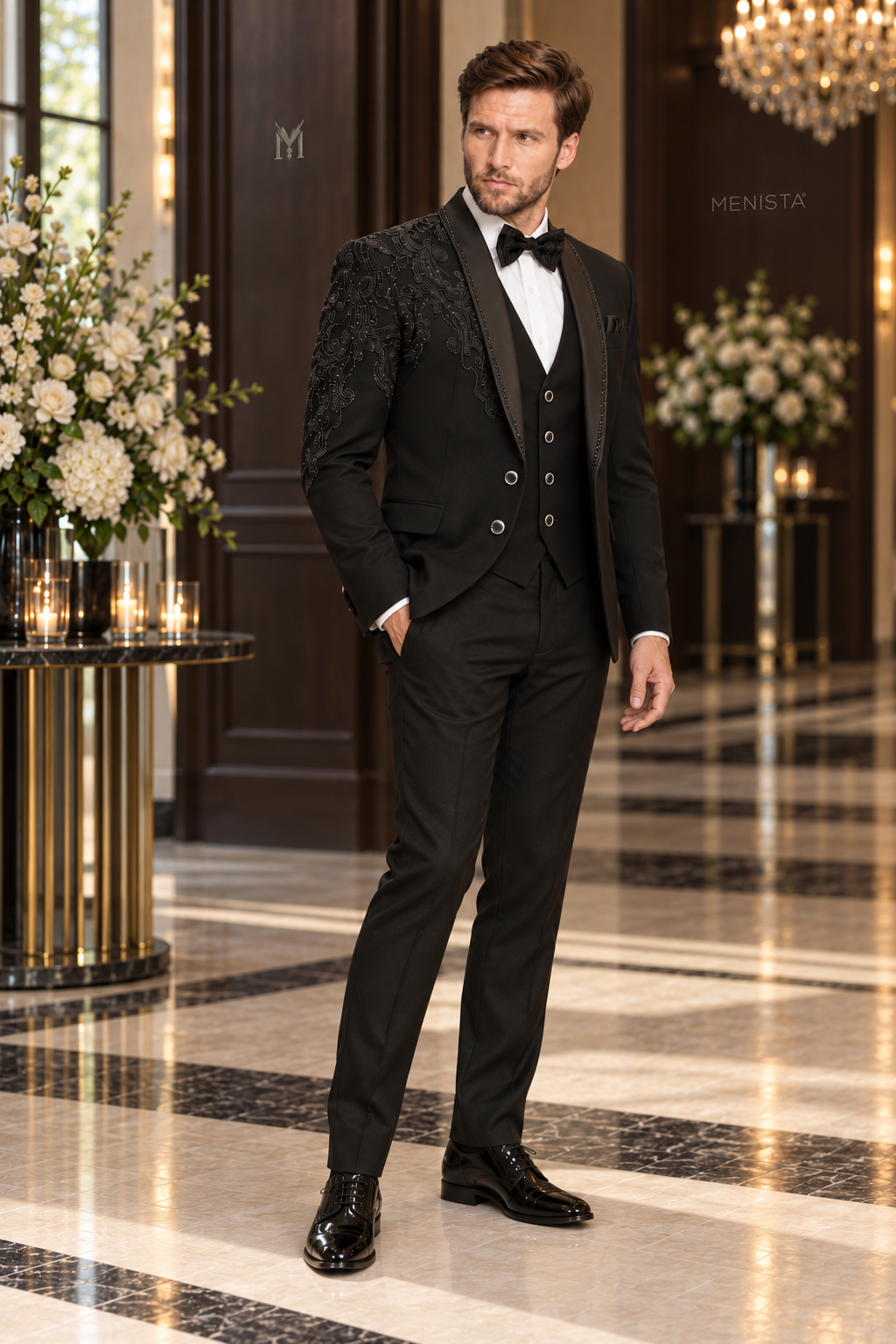 Three-quarter view of Alder black tuxedo with asymmetric paisley bead embroidery