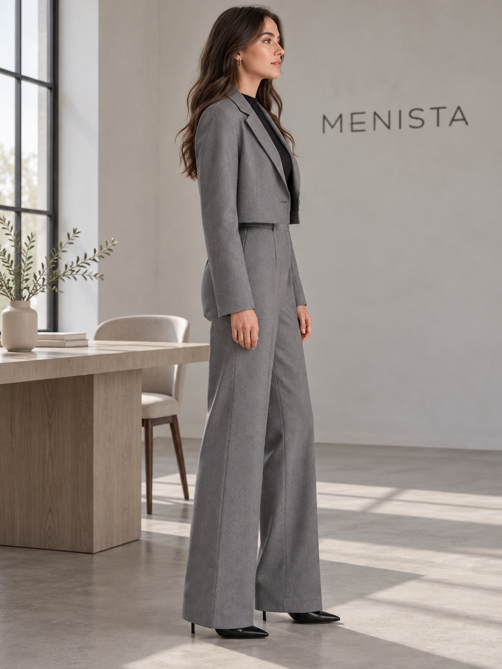 Side view of women’s grey cropped single-button blazer and matching wide-leg trousers.