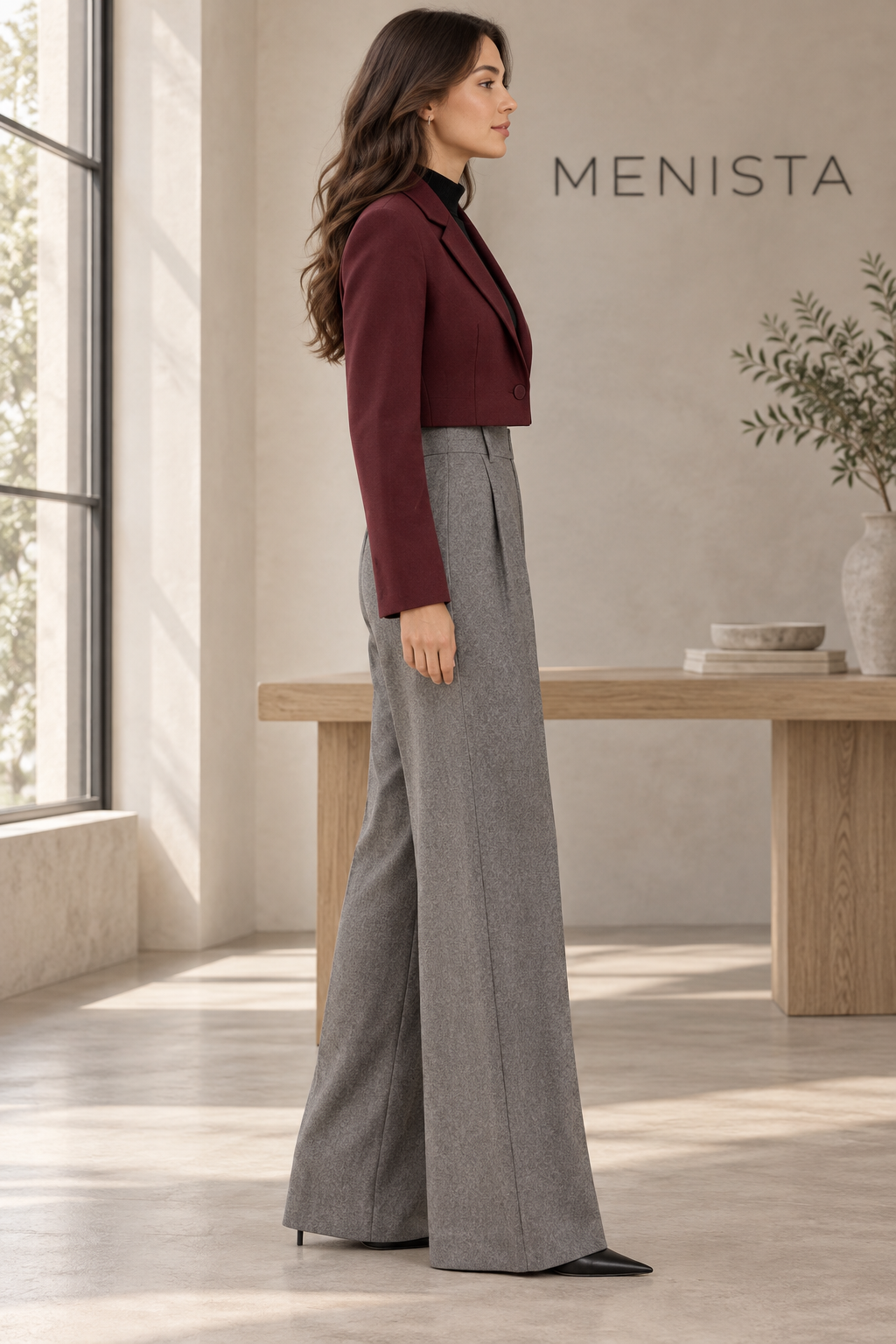 Side view of women’s burgundy cropped jacket and grey melange wide-leg trouser set.