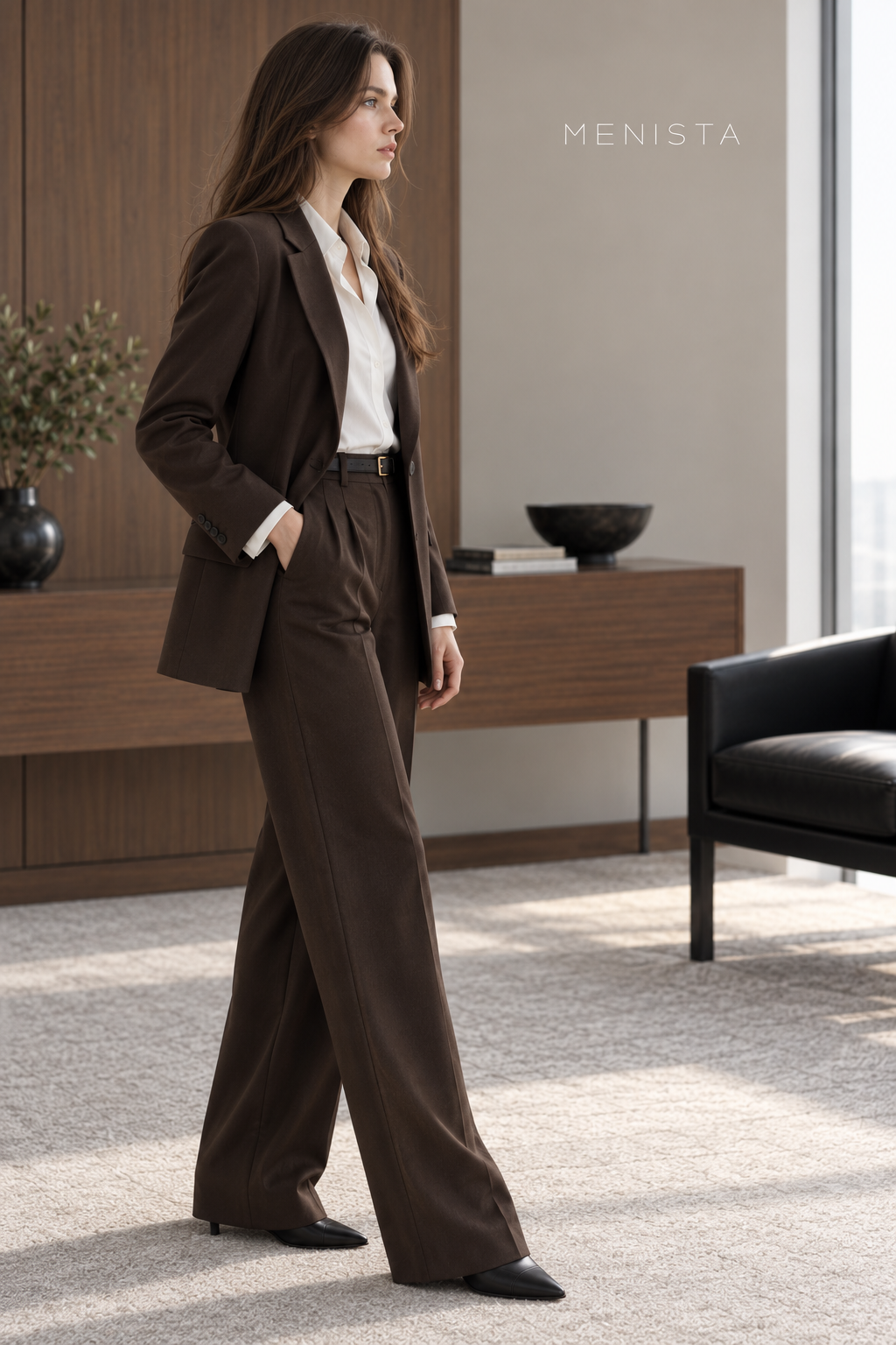 Side view of the women’s chocolate-brown blazer and matching wide-leg trousers.