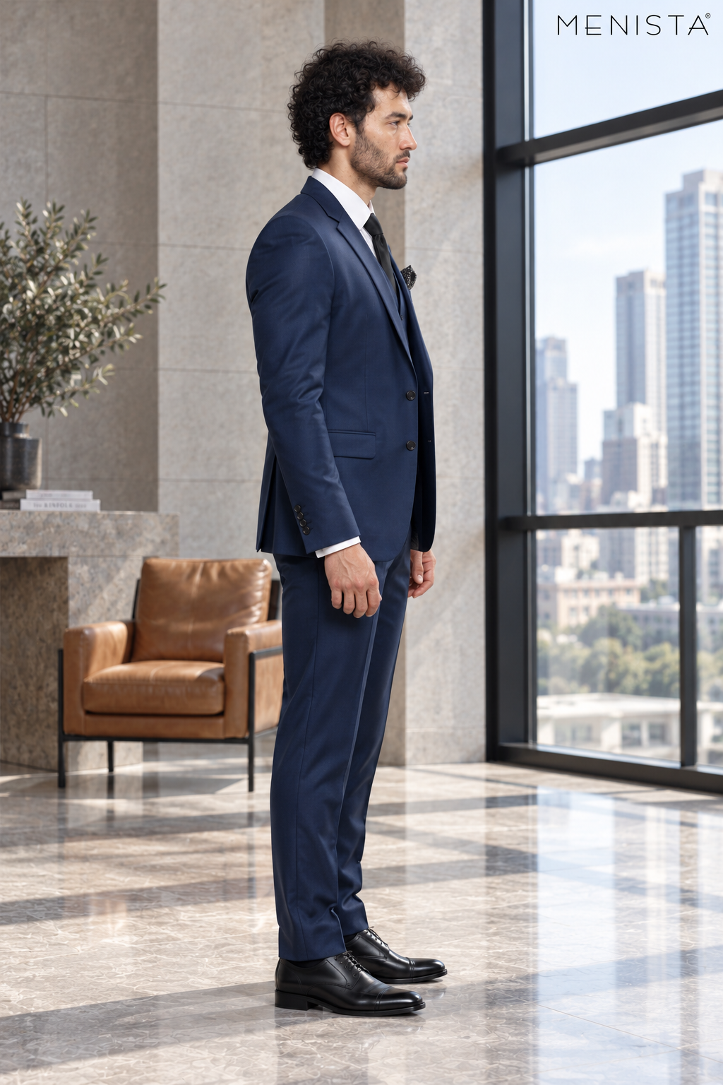 Side profile of Menista navy notch-lapel suit showing tailored silhouette and plastic cuff buttons.