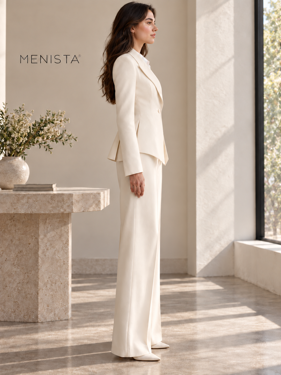 Side view of women’s ivory sculpted peplum jacket with plain sleeves and matching wide-leg trousers.