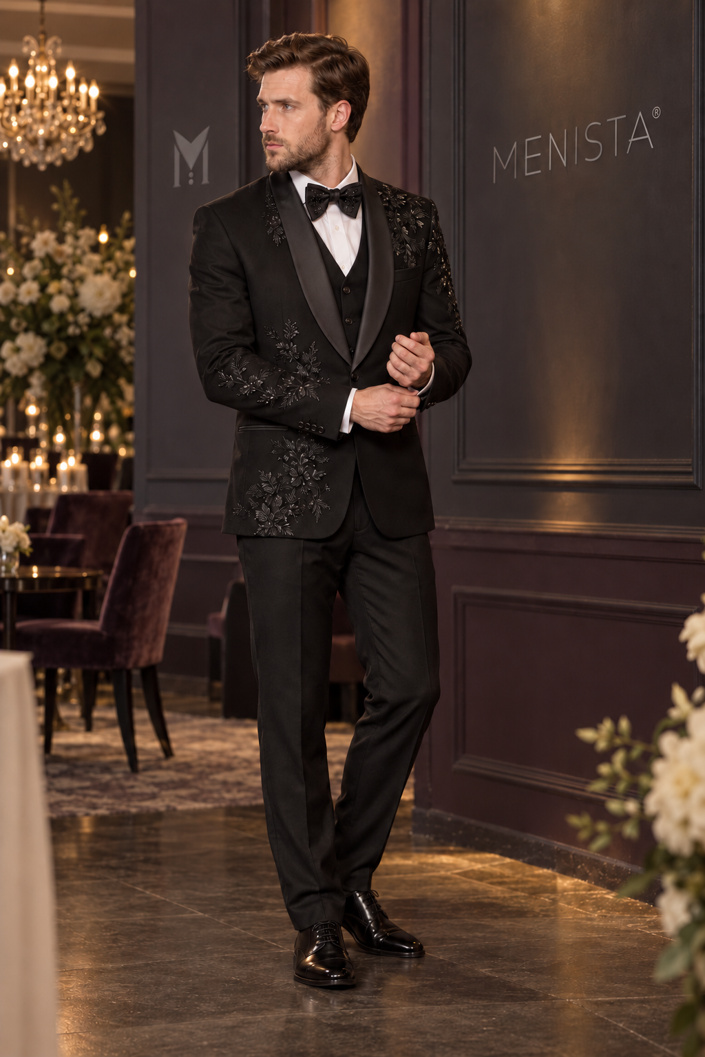 Three-quarter view of Lucien black floral beaded tuxedo with one-button jacket and satin shawl lapels.