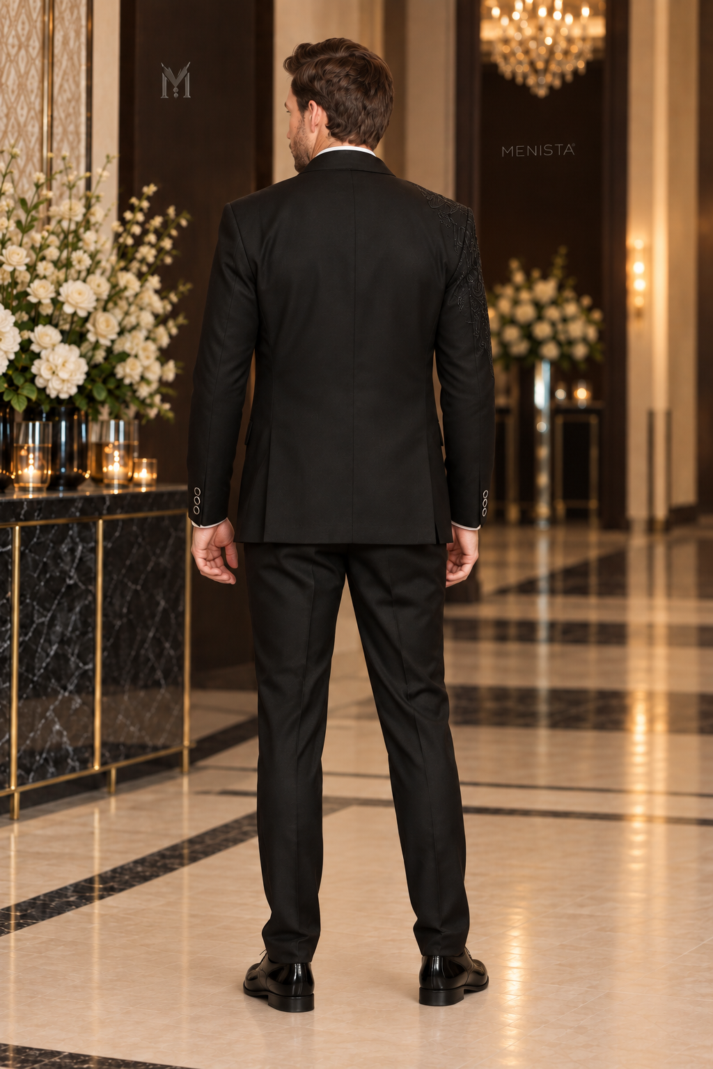 Full-length back view of Alder black tuxedo with double side vents