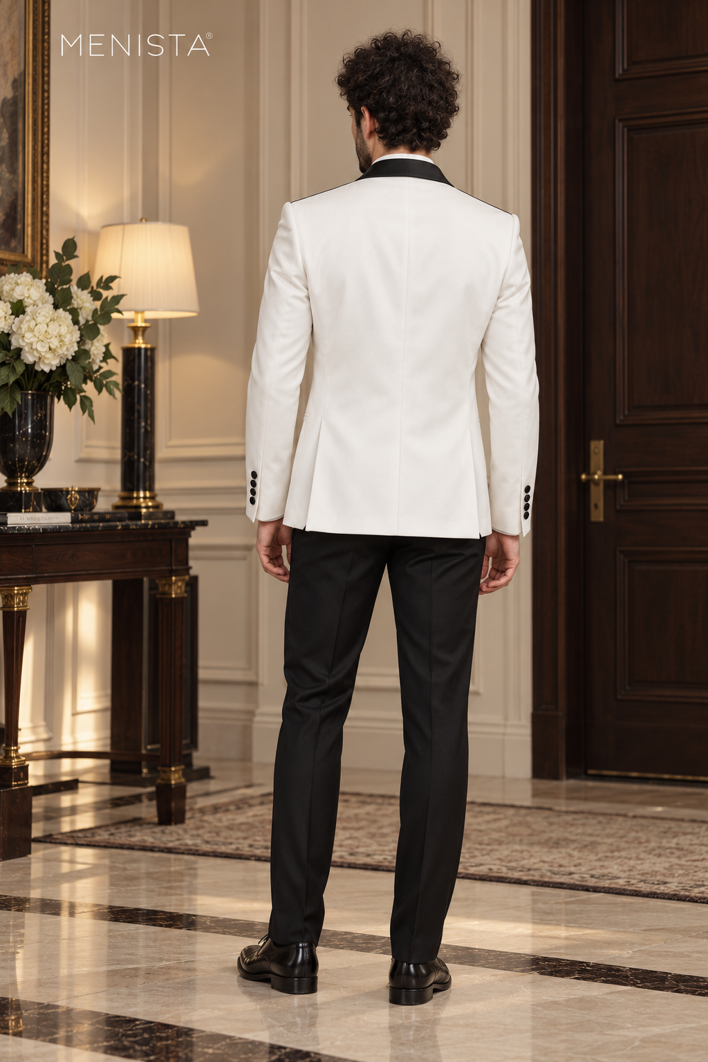 Back view of Menista white tuxedo jacket and black trousers, showing jacket length, shoulders and twin side vents.