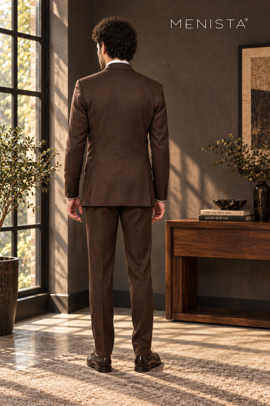 Back view of dark brown Menista jacket with twin side vents and matching trousers.
