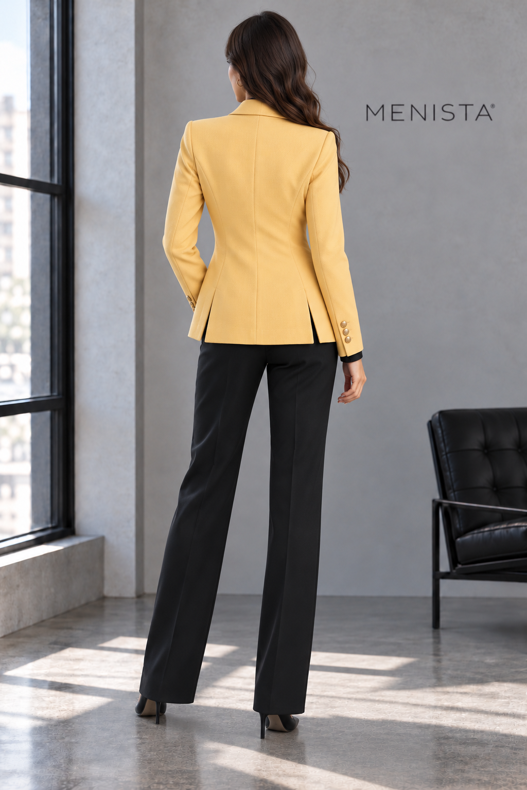 Back view of Honora’s butter-yellow jacket with twin side vents and black trousers.