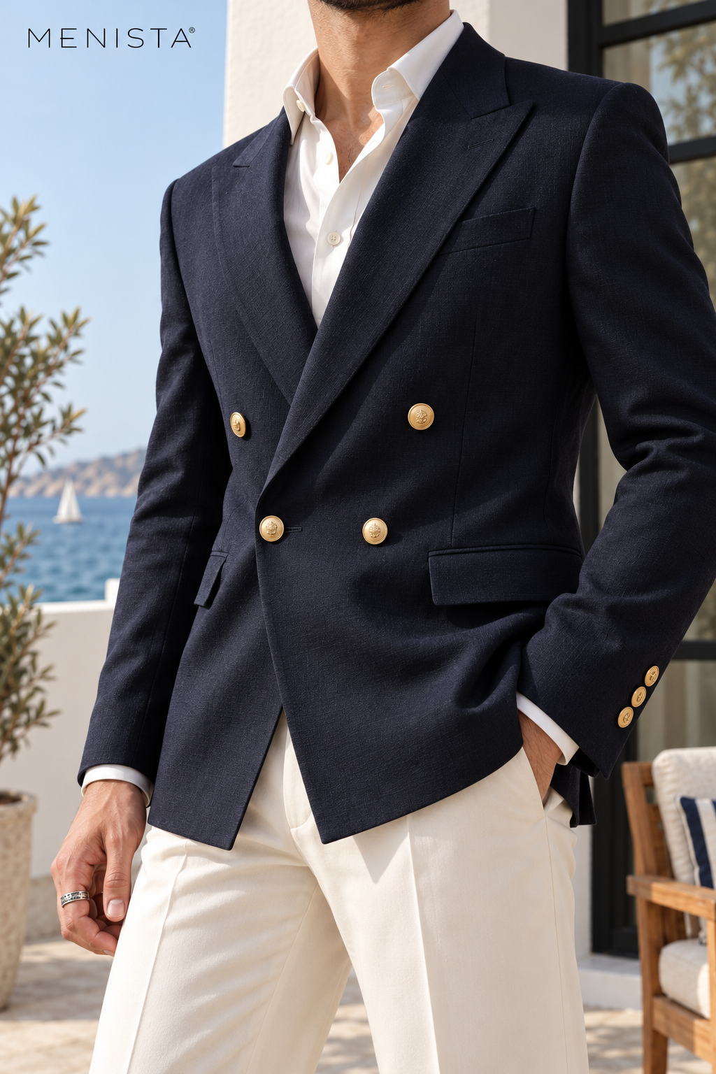 Close-up of navy woven lapels, four gold-toned front buttons, flap pockets and three cuff buttons.