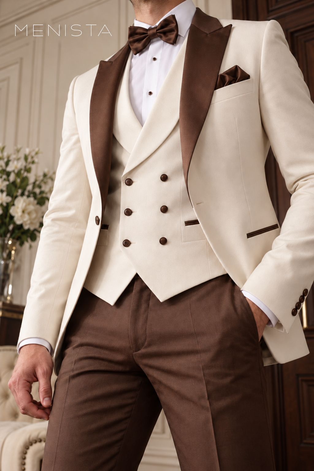 Close-up of Menista ivory single-button jacket with brown satin peak lapels and an ivory double-breasted waistcoat with six buttons in three paired rows.