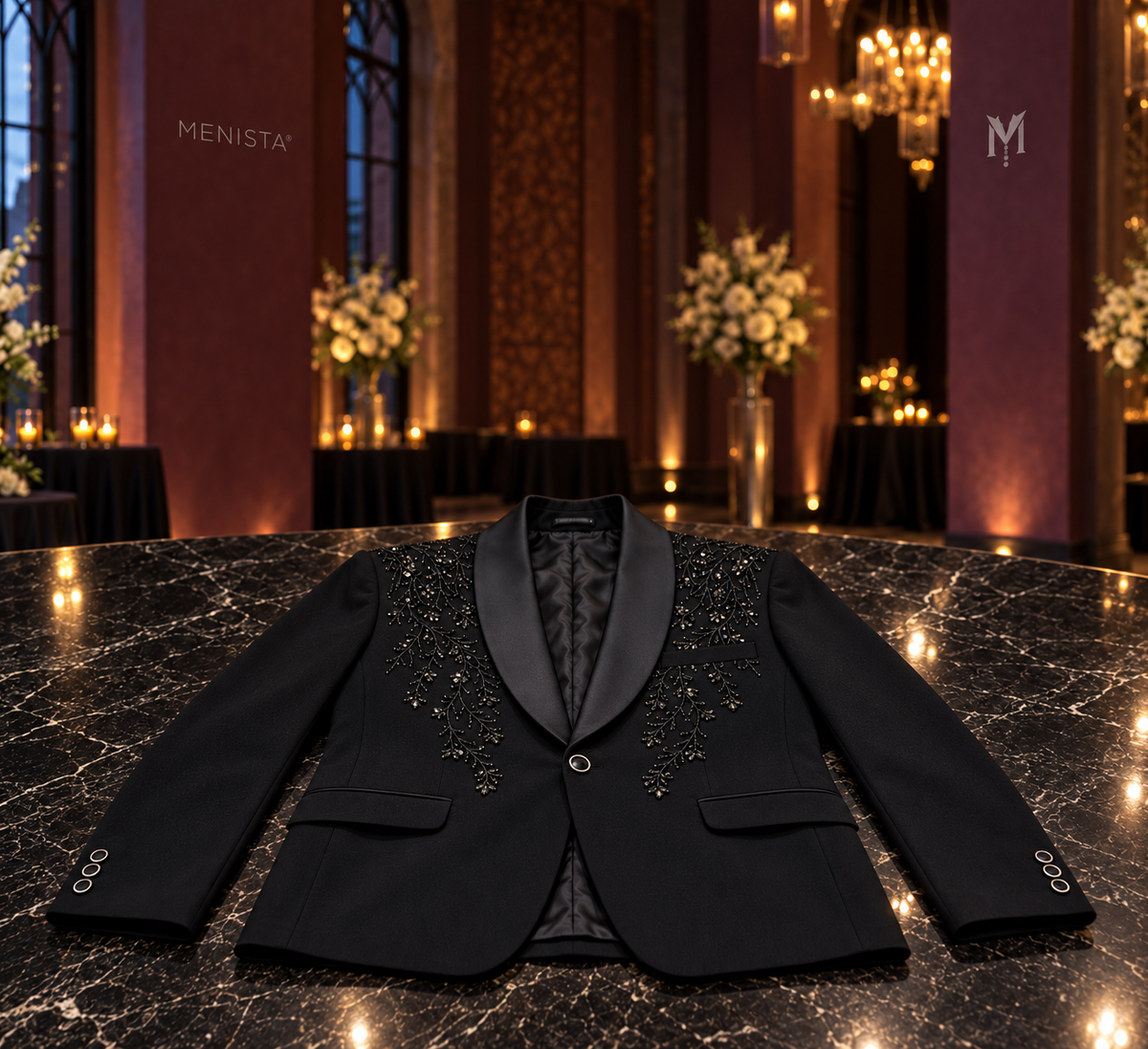 Cyran black botanical beaded jacket wholly supported on a flat marble table, with one front button and two flap pockets.