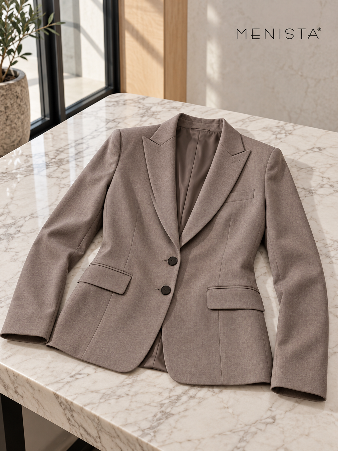 Women’s taupe two-button jacket with pointed peak lapels resting flat with naturally supported sleeves.