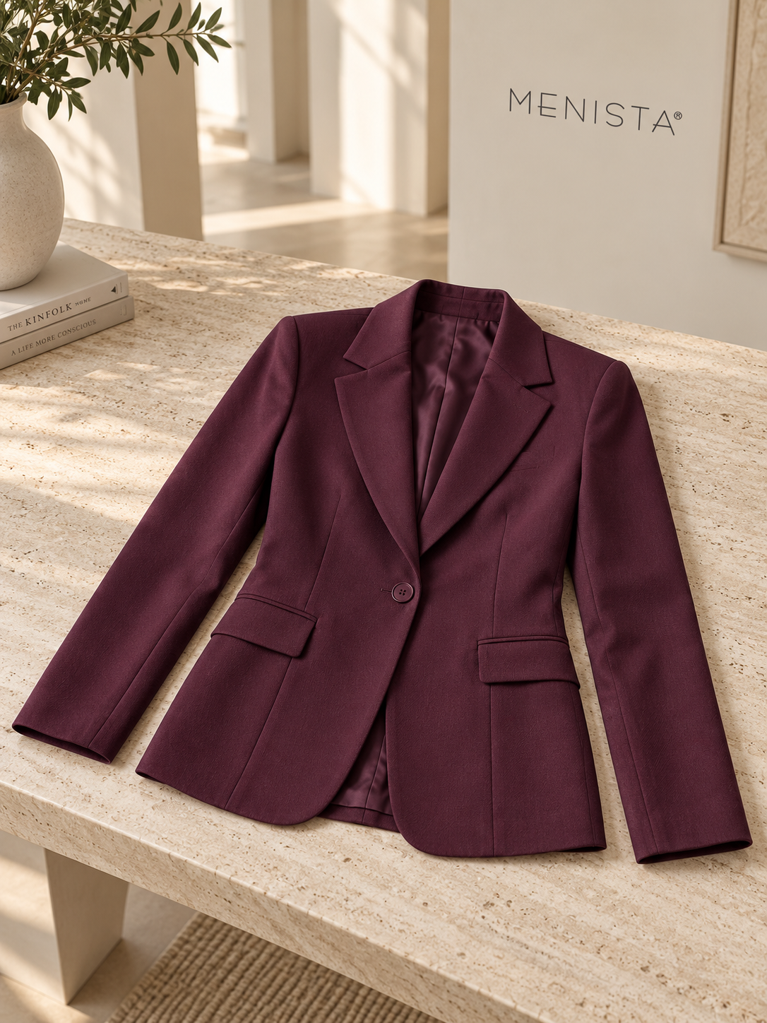 The jacket from the women’s deep plum single-button jacket and matching wide-leg trousers, arranged flat with naturally supported sleeves.