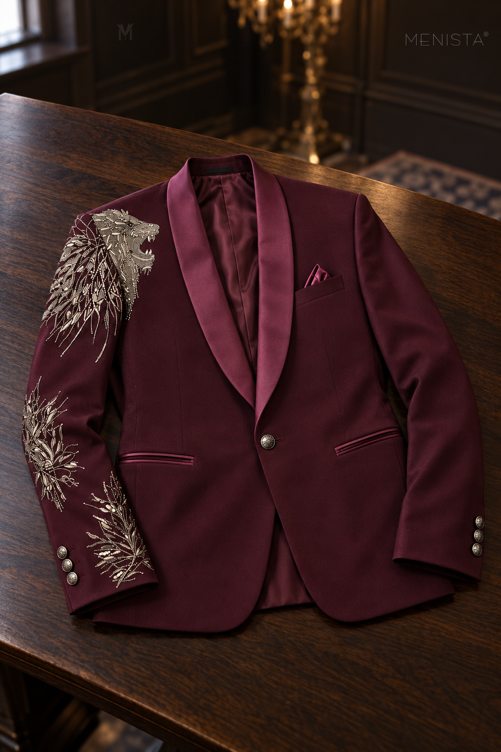Leonis one-button burgundy lion embroidered jacket laid flat on a wooden table