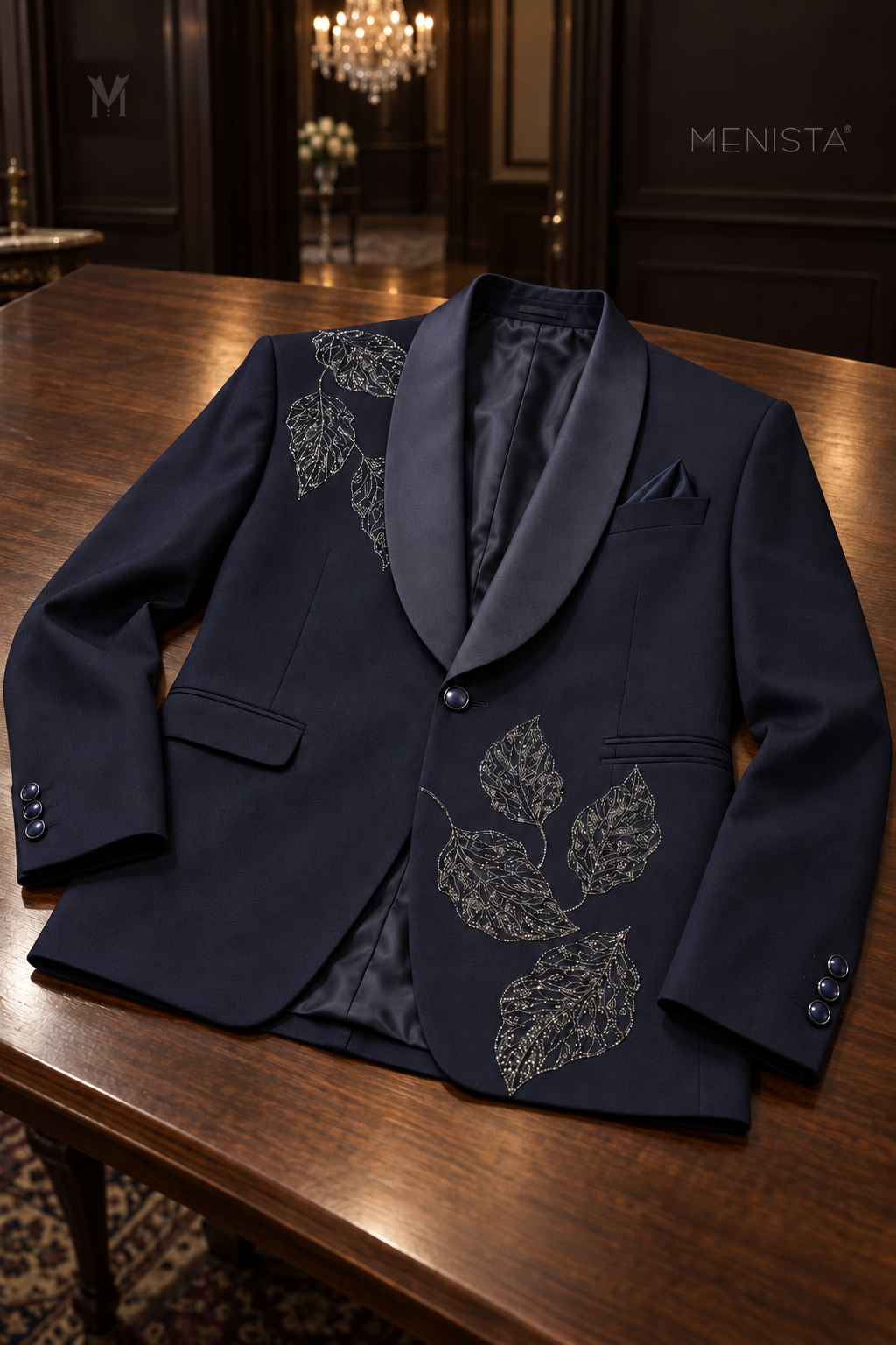 Menista Sylvan navy leaf embroidered tuxedo jacket laid flat, showing satin shawl lapels, pockets and silver beaded leaf details.