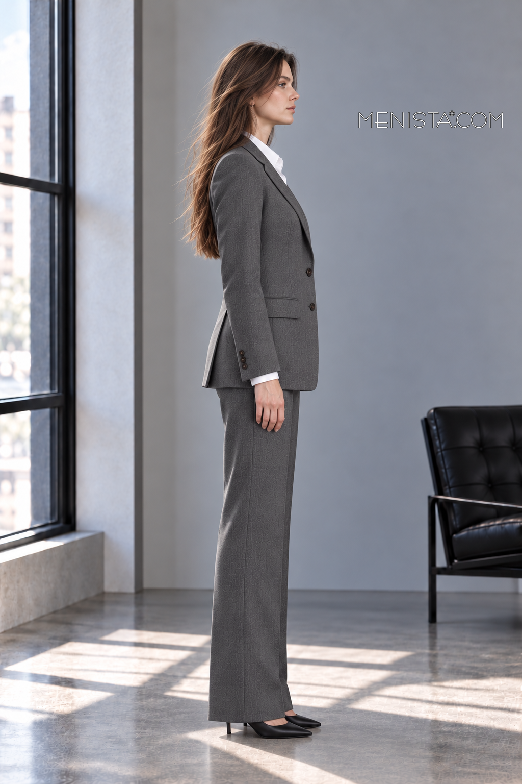 Elowen charcoal-melange jacket and matching wide-leg trousers, full-body true side profile on Sofia.