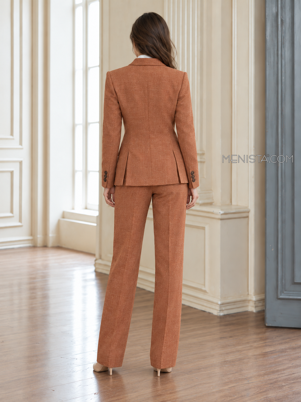 Back of Artemise linen suit showing twin rear jacket vents and matching full-length trousers.