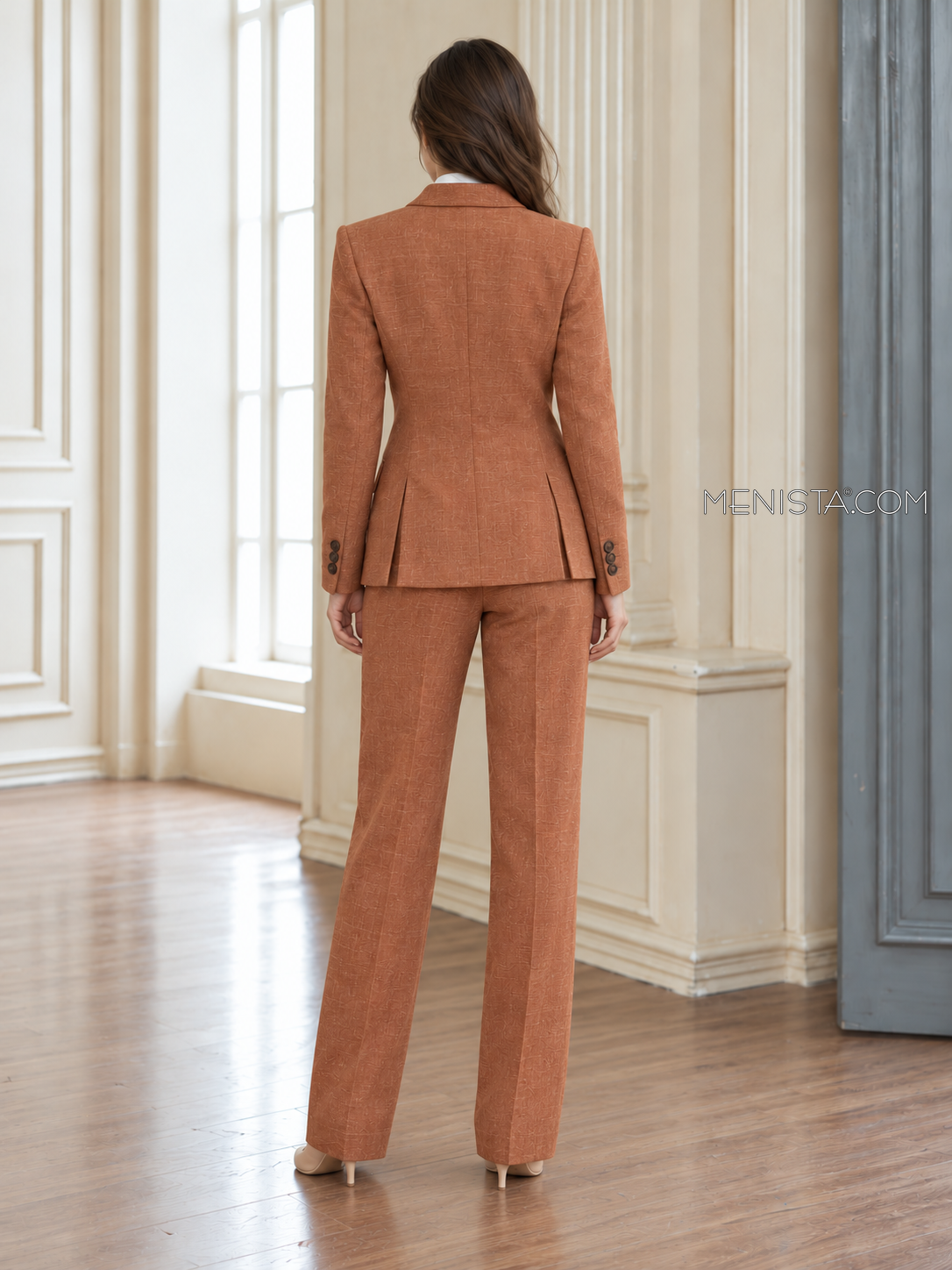 Back of Artemise linen suit showing twin rear jacket vents and matching full-length trousers.