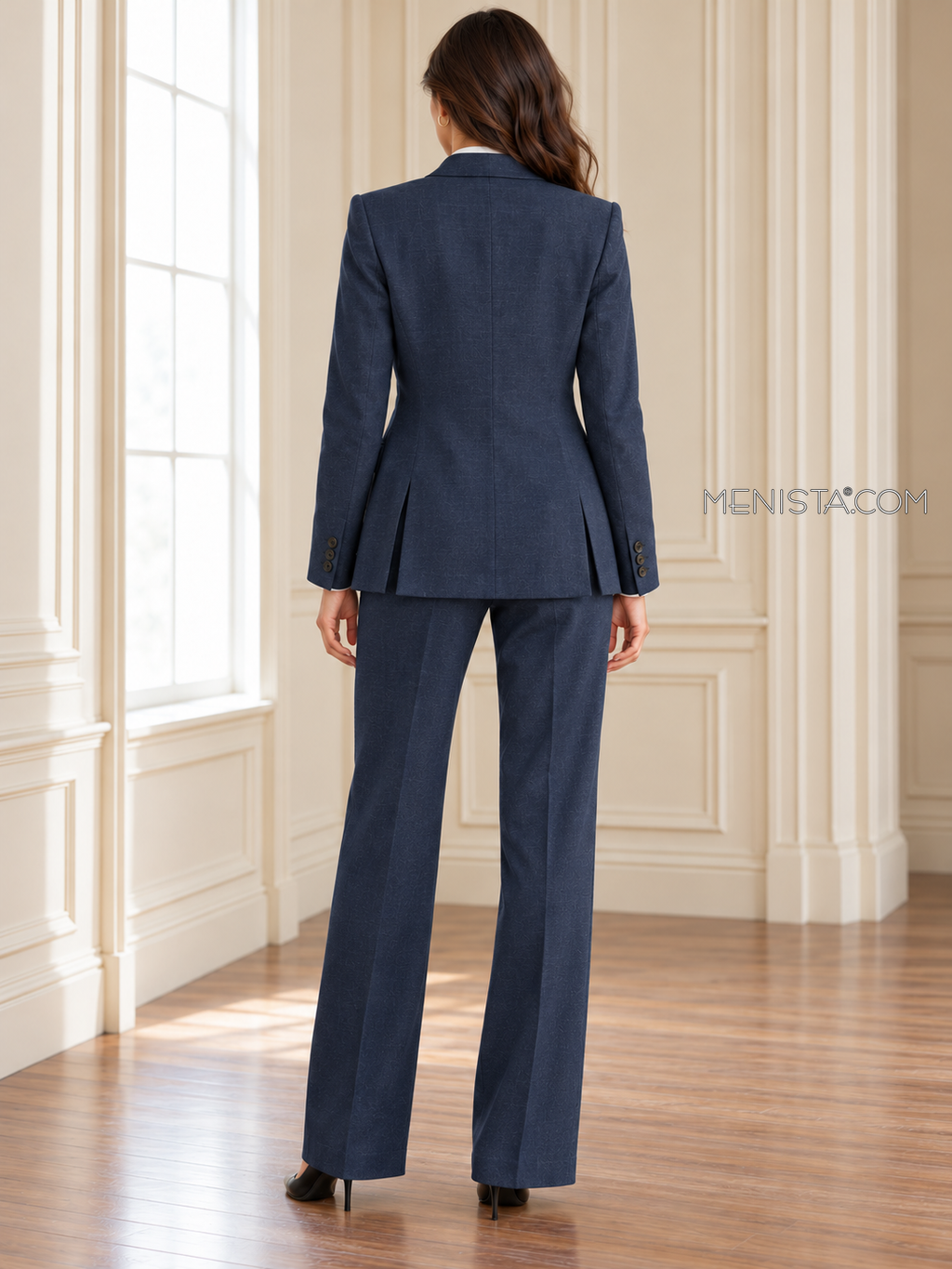 Back of Calanthe linen suit showing twin rear jacket vents and matching full-length trousers.