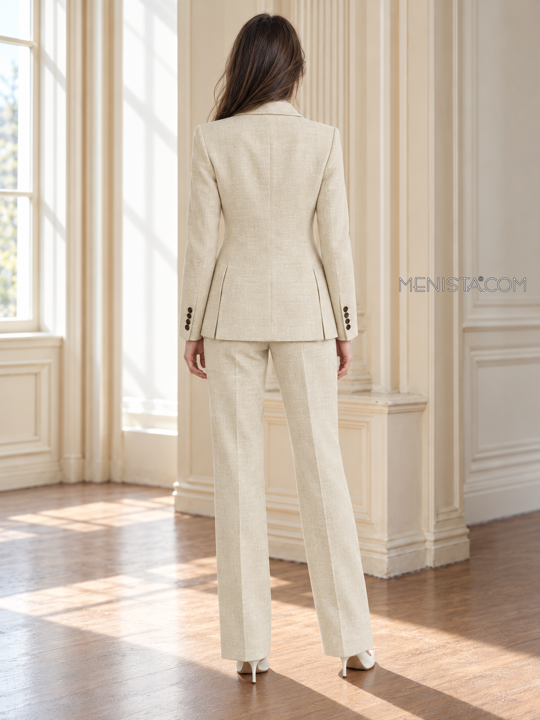Back of Camellia linen jacket showing twin rear vents and matching full-length trousers.