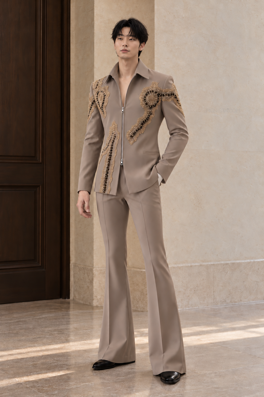 Kevin wearing the Elouan taupe embroidered zip-front two-piece suit with matching flared trousers, full front view.