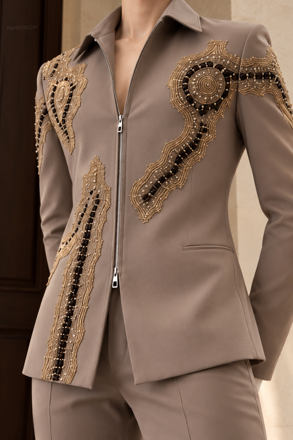 Close-up of Elouan's pointed shirt-style collar, silver-tone zip, gold-toned embroidery and dark beaded detailing.