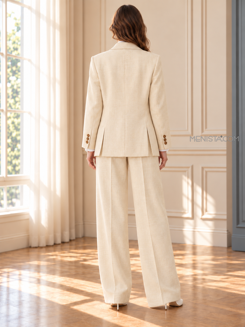 Eulalie women’s pale cream oversized linen suit, back view showing twin rear jacket vents and wide-leg trousers.