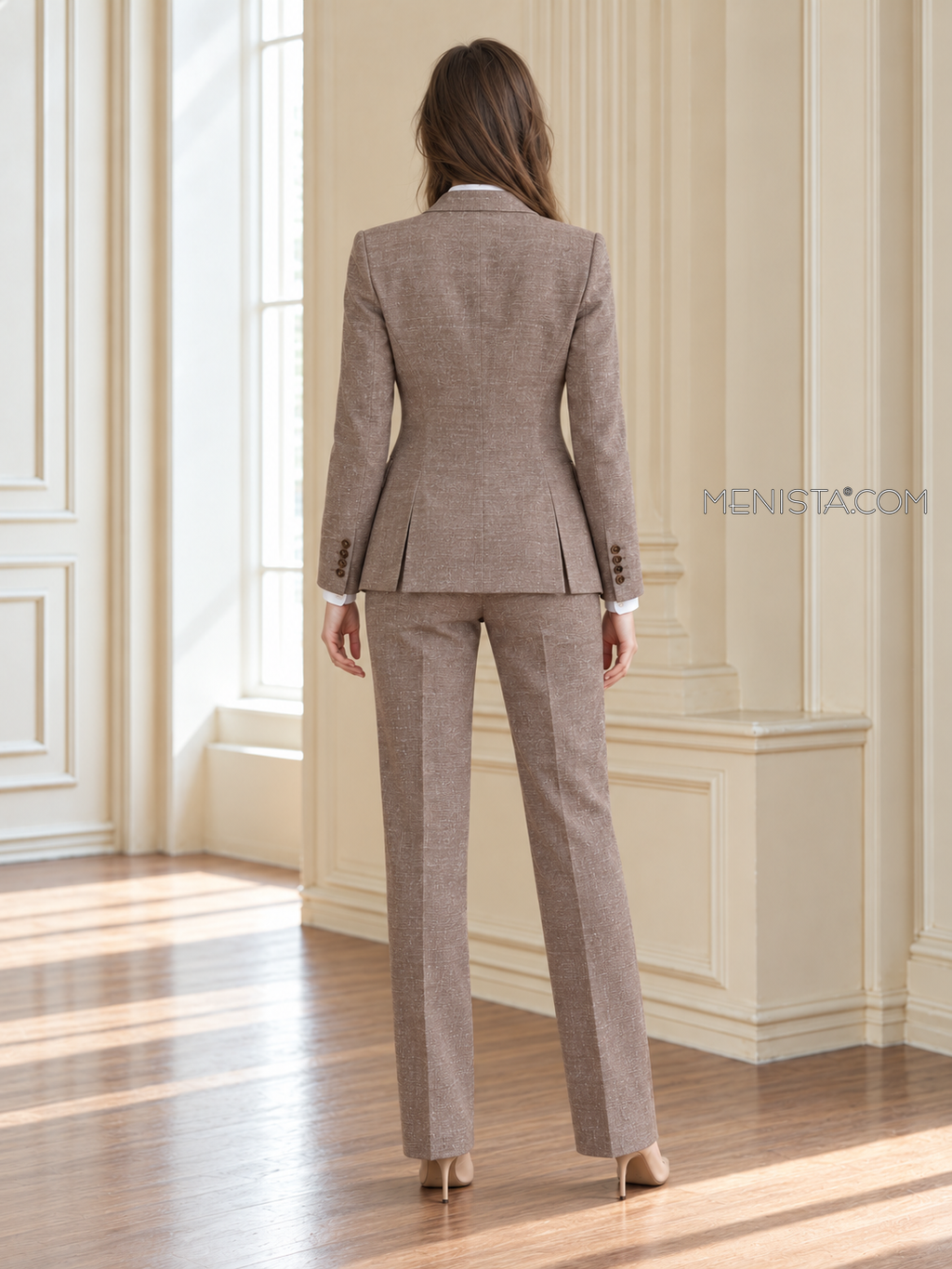 Back of Euphrosyne linen jacket showing twin rear vents and matching full-length trousers.