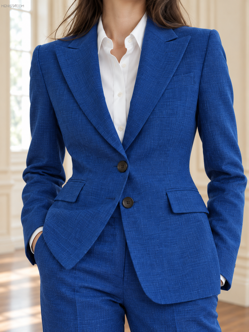 Close-up of Iseult royal blue linen jacket with pointed peak lapels and two-button front.