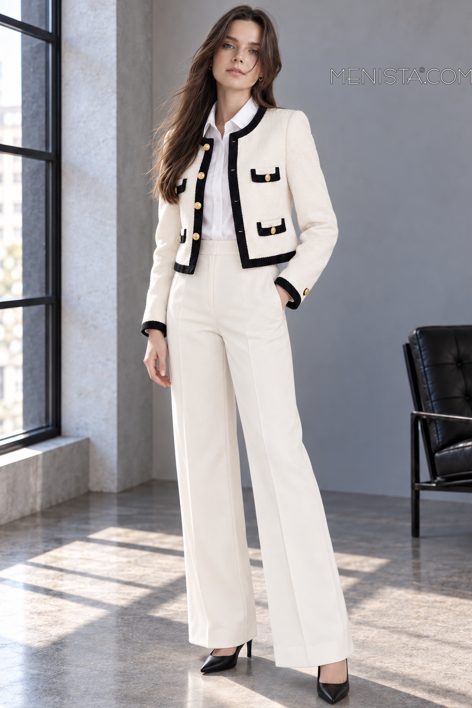 Odeline ivory and black two-piece suit on Sofia, gentle three-quarter view.