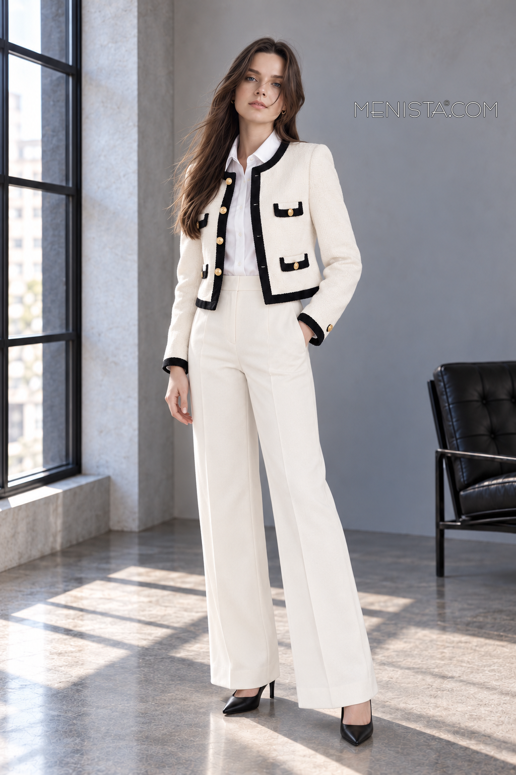 Odeline ivory and black two-piece suit on Sofia, gentle three-quarter view.