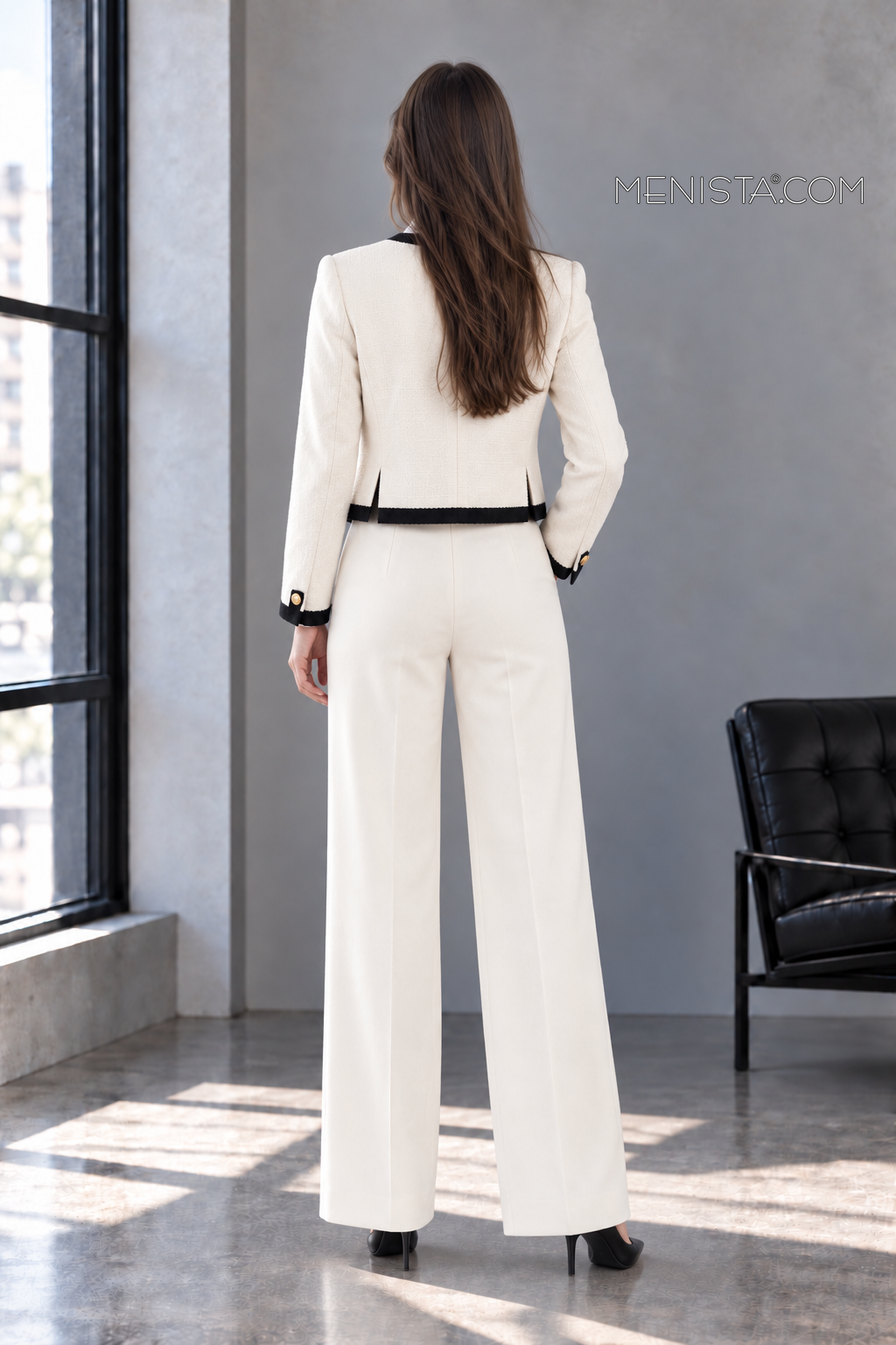 Back view of Odeline ivory jacket with twin rear jacket vents and matching trousers.