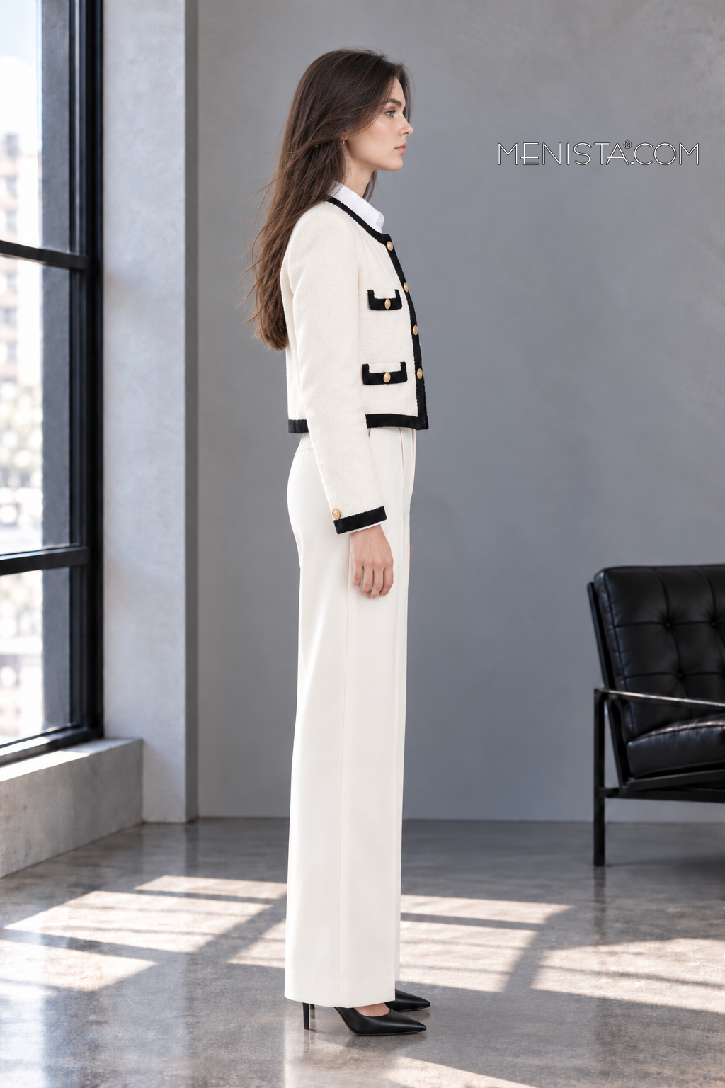 Odeline ivory and black two-piece suit on Sofia, full-body true side profile.