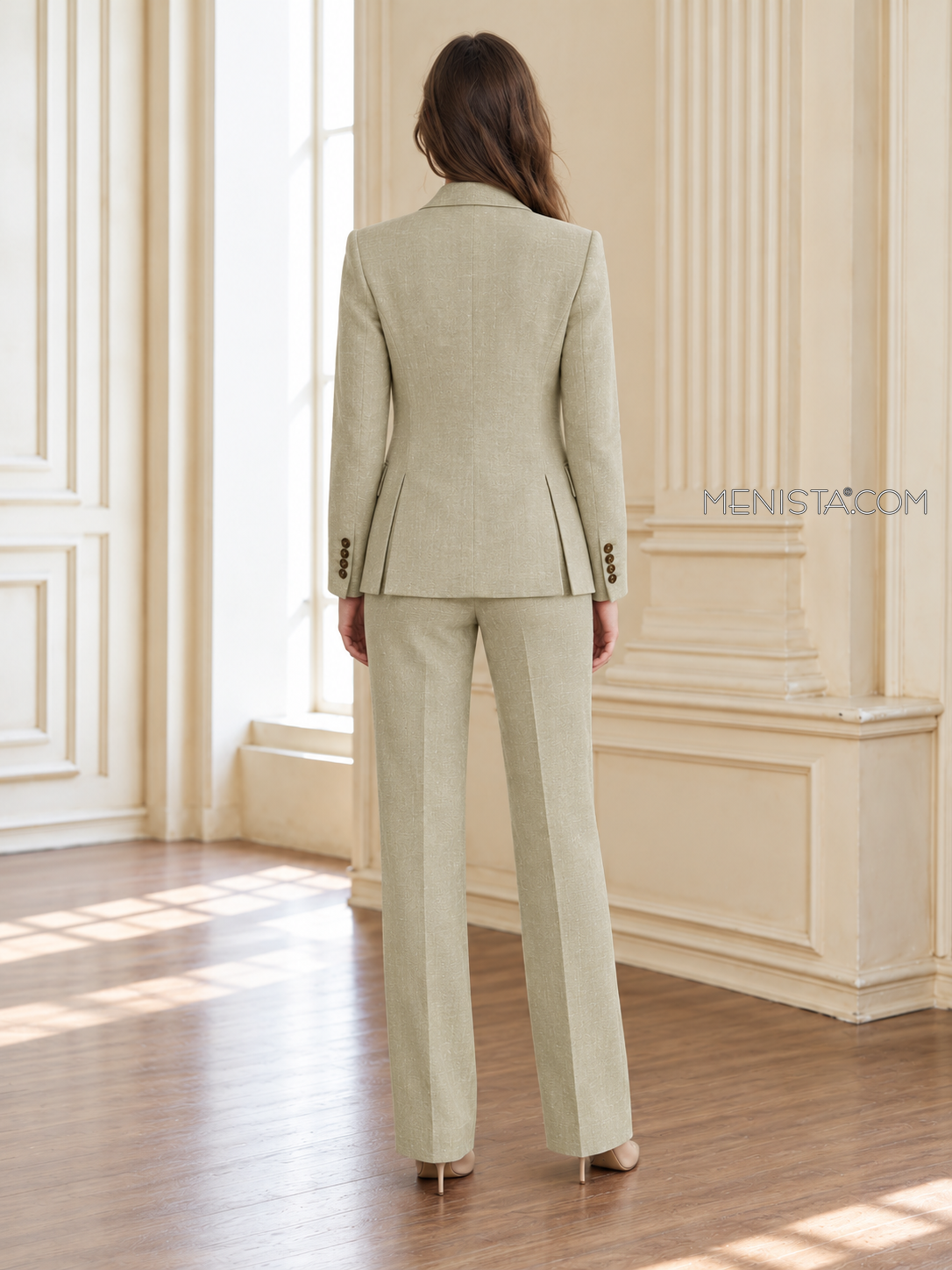 Back of Oriane linen jacket showing twin rear vents and matching full-length trousers.