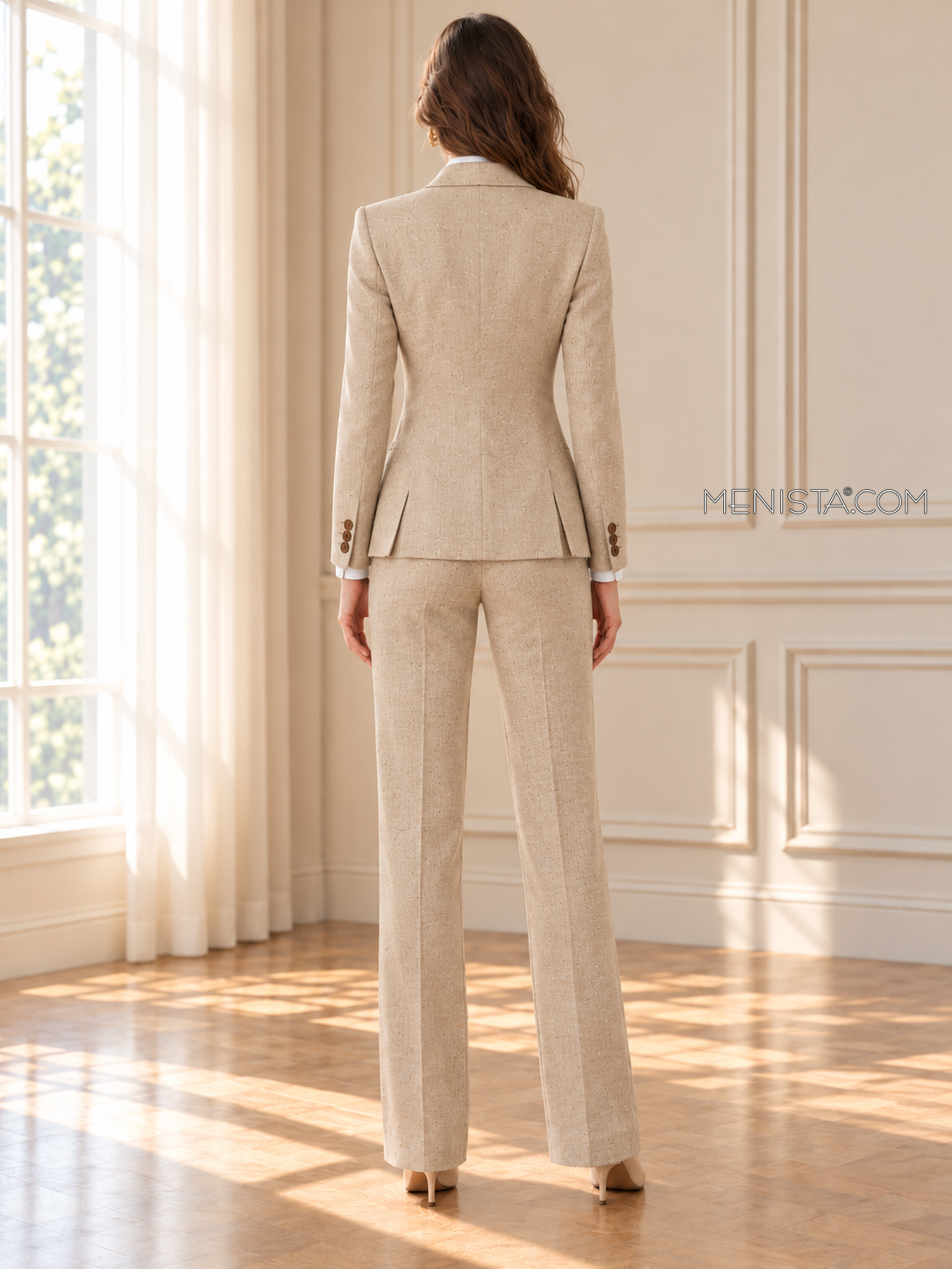 Back of Sandrine linen suit showing twin rear jacket vents and matching full-length trousers.