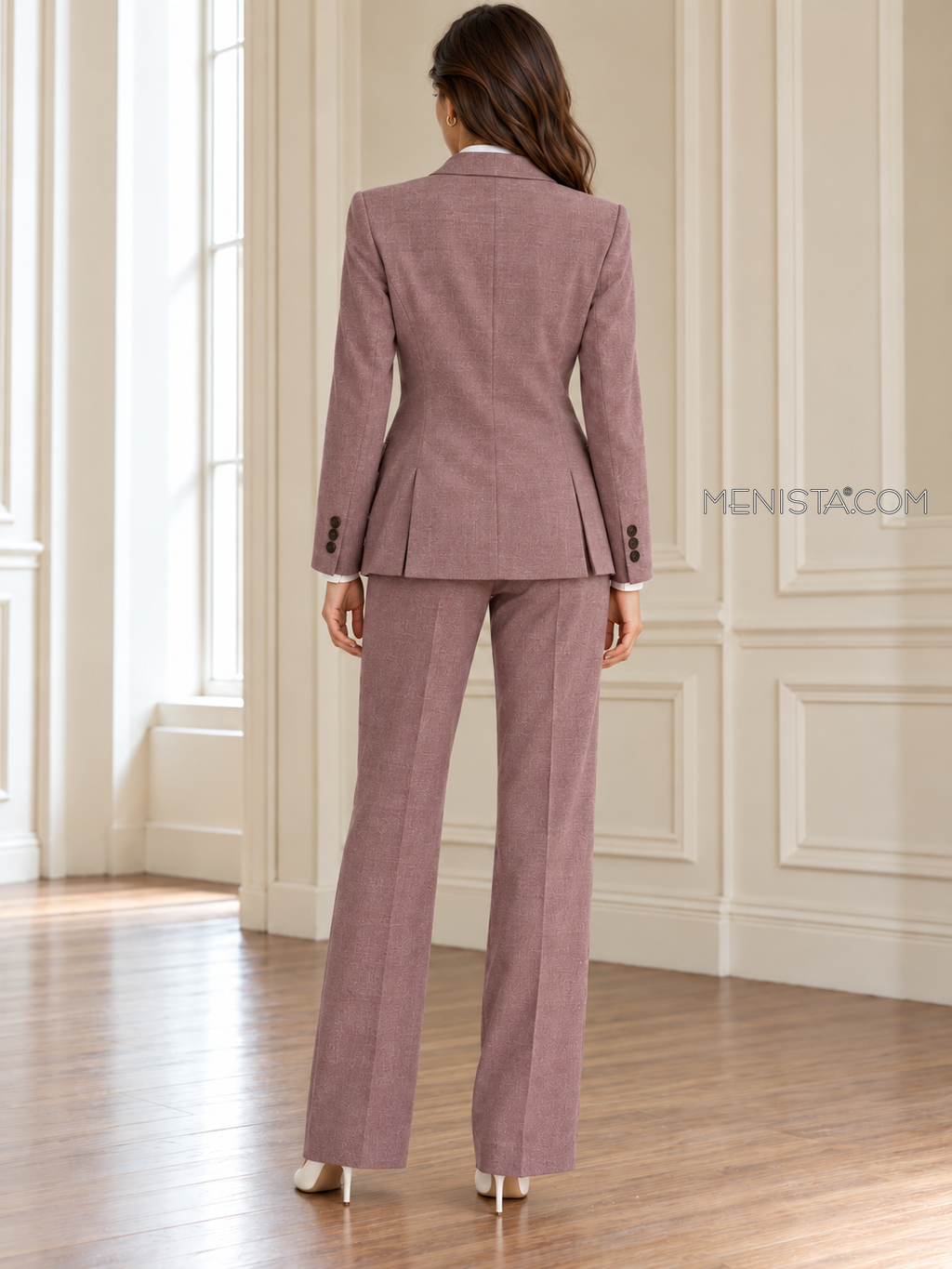 Back of Seraphine linen suit showing twin rear jacket vents and matching full-length trousers.