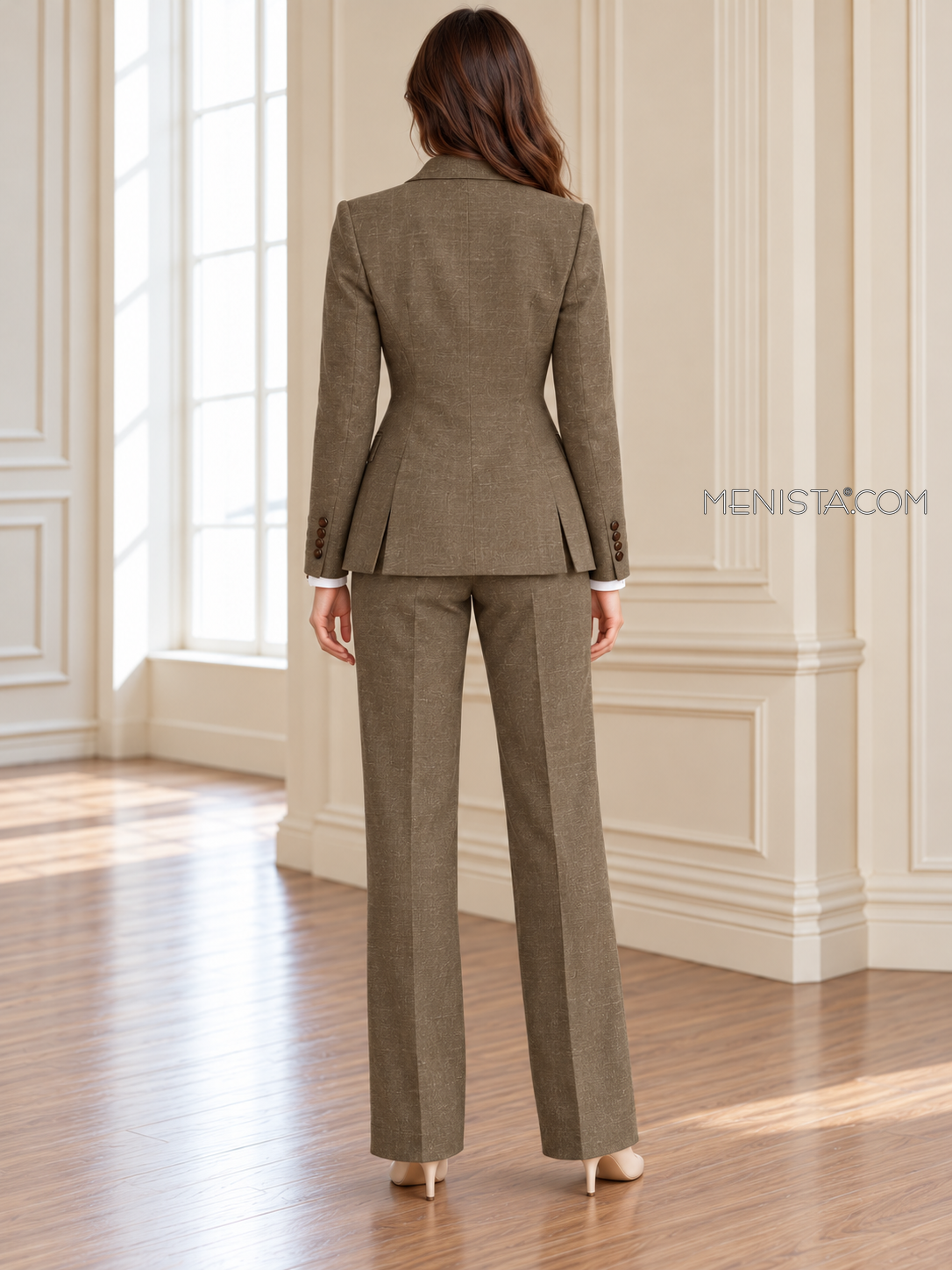Back of Thessaly linen jacket showing twin rear vents and matching full-length trousers.