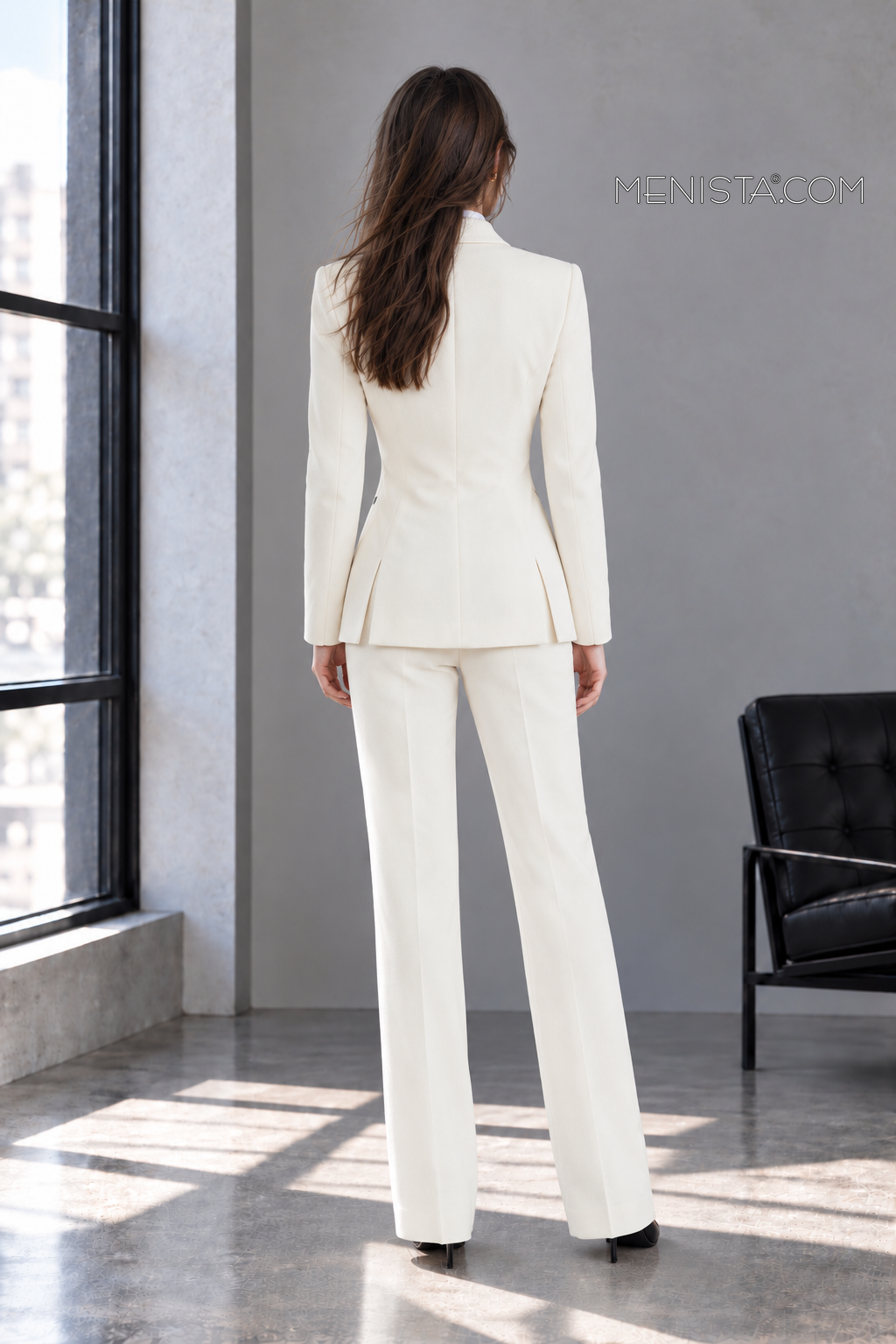 Back view of Vespera ivory jacket with twin rear jacket vents and matching trousers.