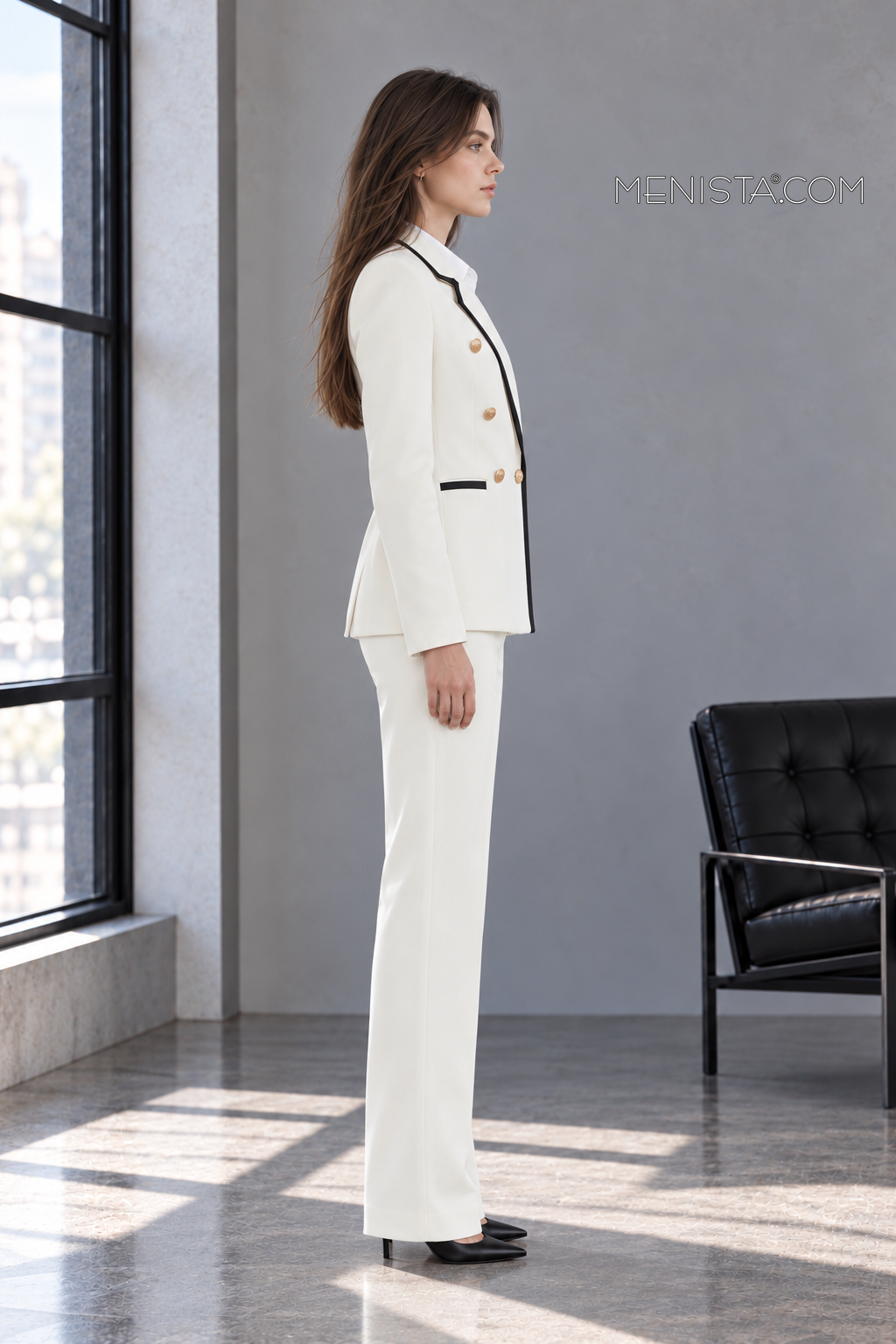 Vespera ivory and black two-piece suit on Sofia, full-body true side profile.