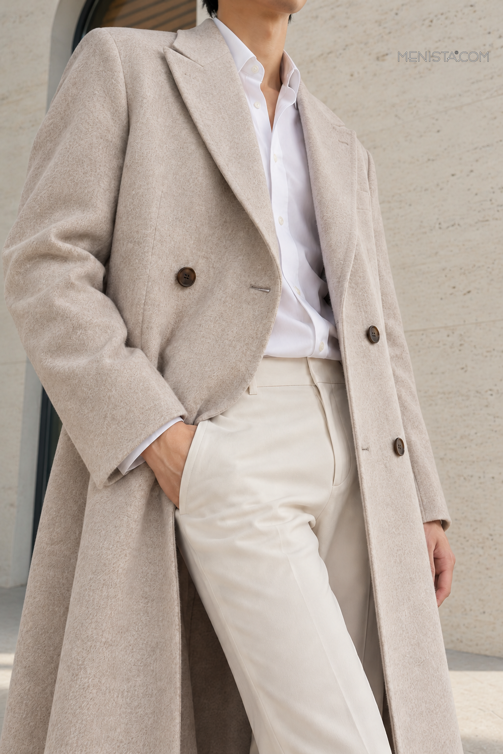 Close-up of lapels, buttons and fabric of the Alarion Light Oatmeal Wool Blend Double-Breasted Long Coat.