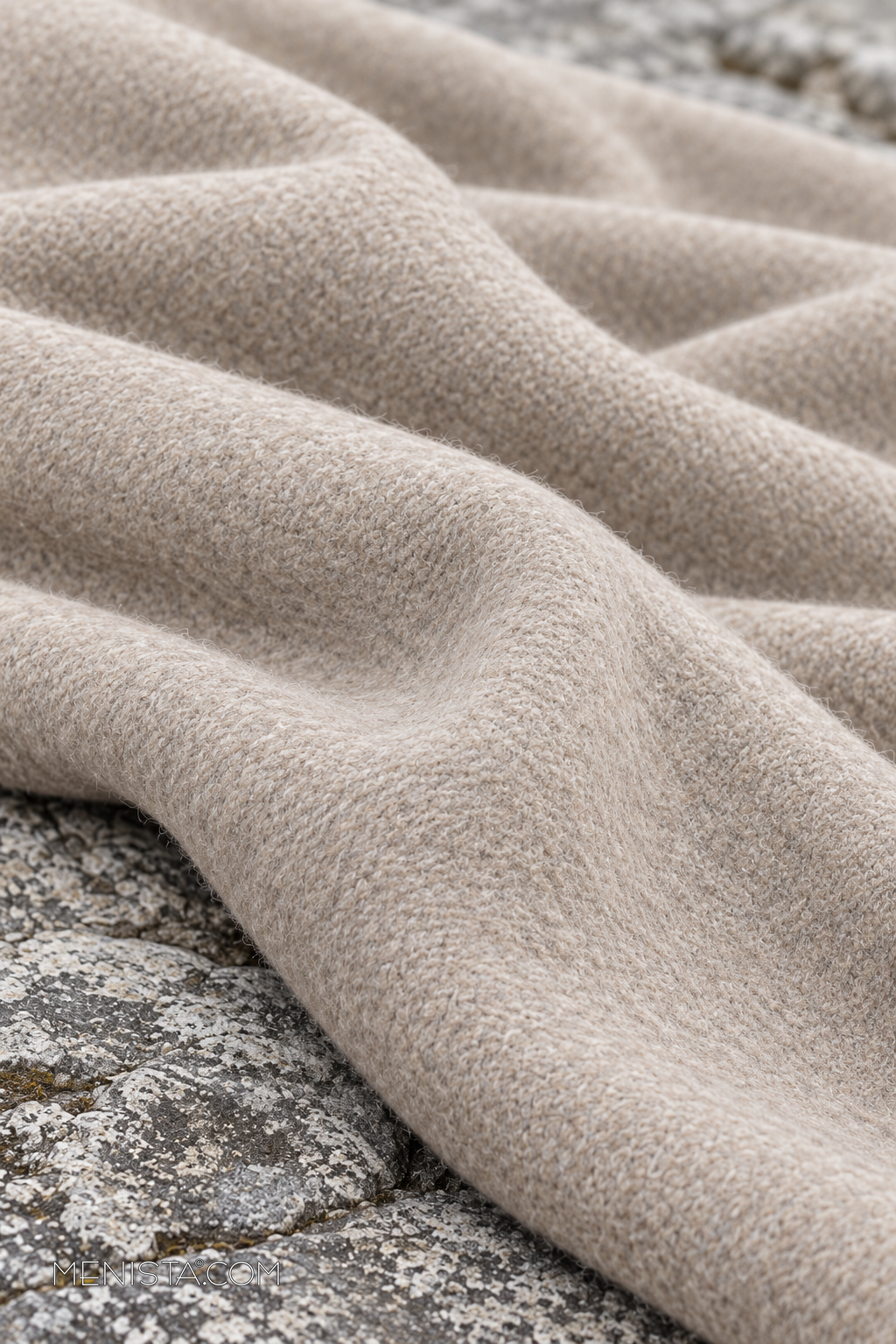 Draped fabric detail of the Alarion Light Oatmeal Wool Blend Double-Breasted Long Coat.