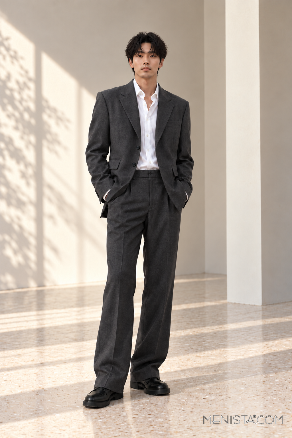 Kevin wearing the Bastian charcoal 2PC suit, full-body front view.
