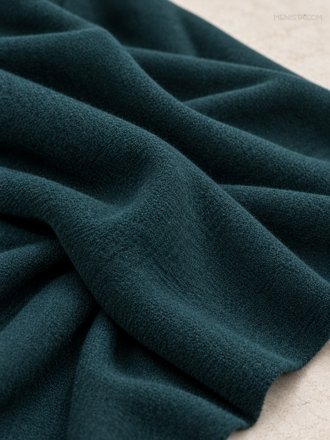 Deep Teal women’s tweed long coat — draped fabric detail.