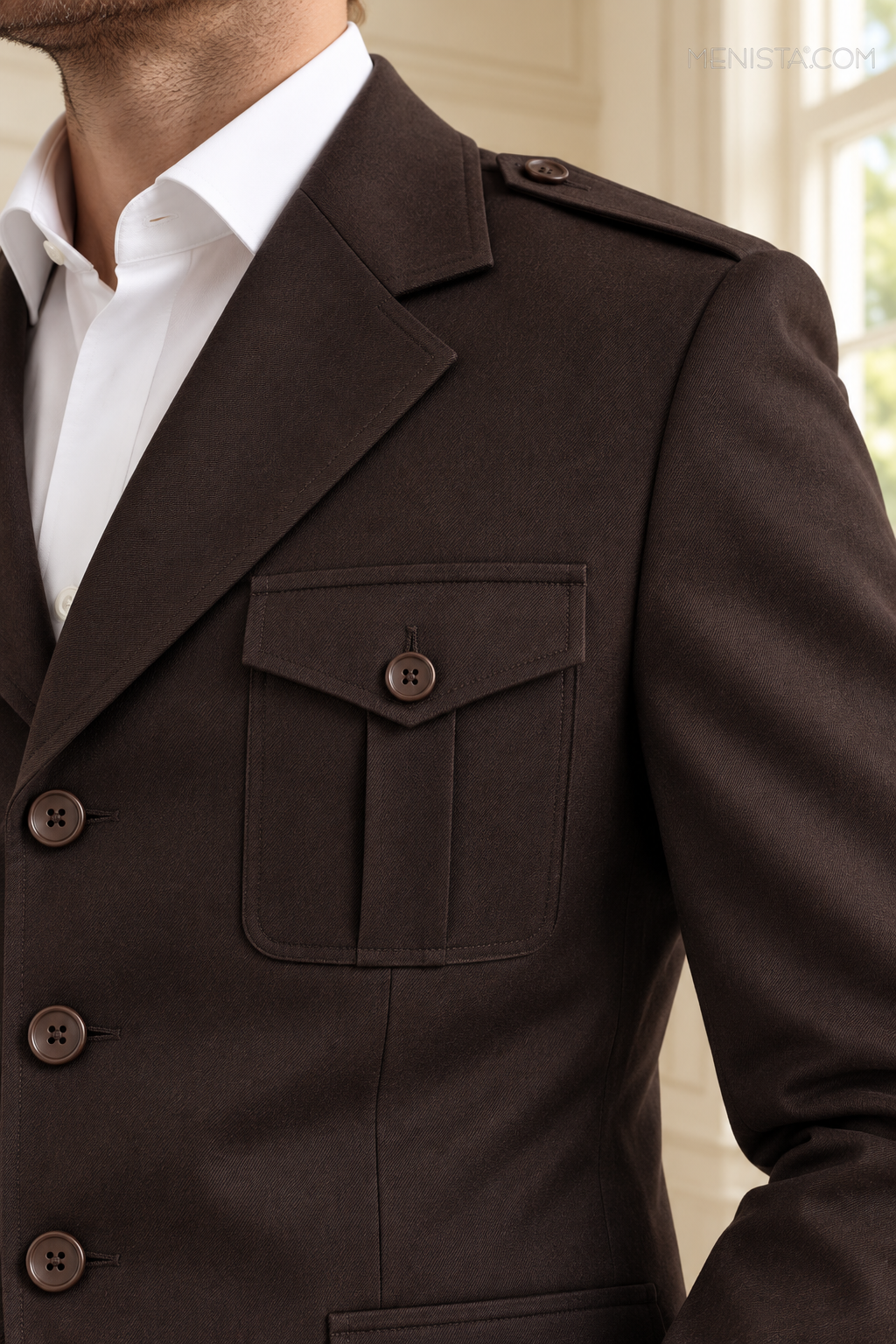 Close-up of the dark brown jacket fabric, lapel and pocket construction.