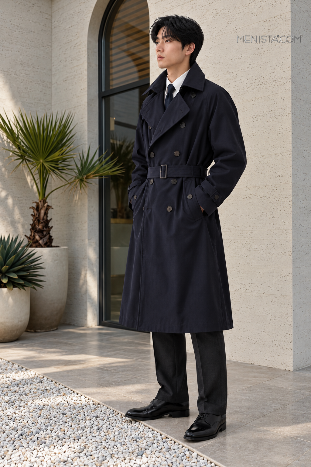 Side and three-quarter view of the Renwick Deep Navy Wool Blend Belted Trench Coat.